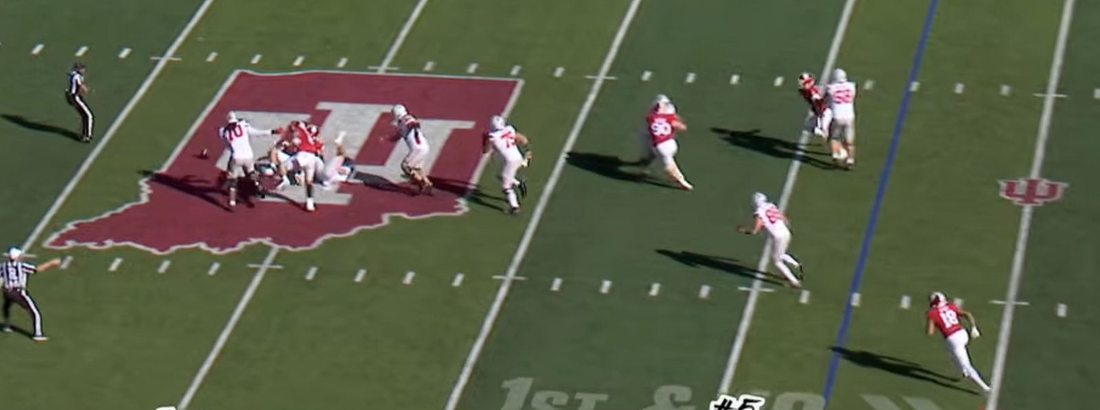 Loose ball at the Indiana logo, an Ohio State lineman next to it, Indiana 18 sprinting away